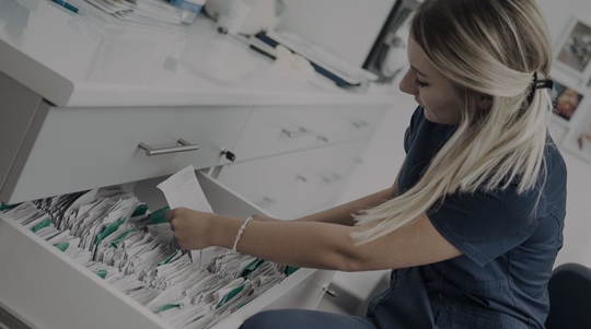 female nurse going through medical records