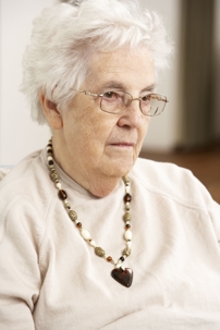 Elderly Woman Looking Downtrodden